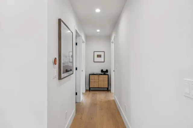 a view of a dining room with wooden floor