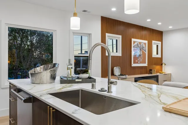 a swimming pool with outdoor seating and garden