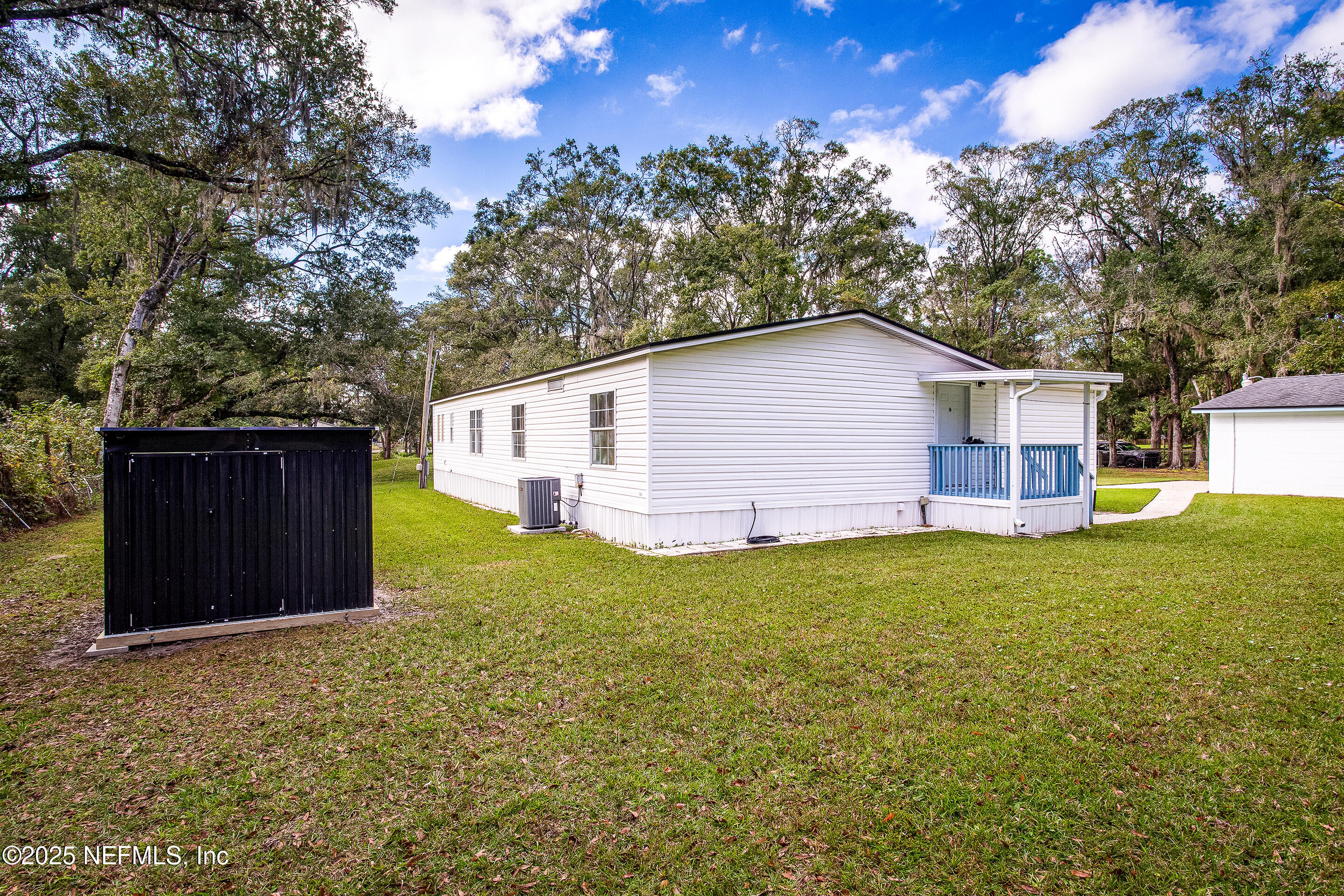 231 Knight Boxx Road Middleburg, FL 32068 - Photo 6 of 31 back porch and covered well