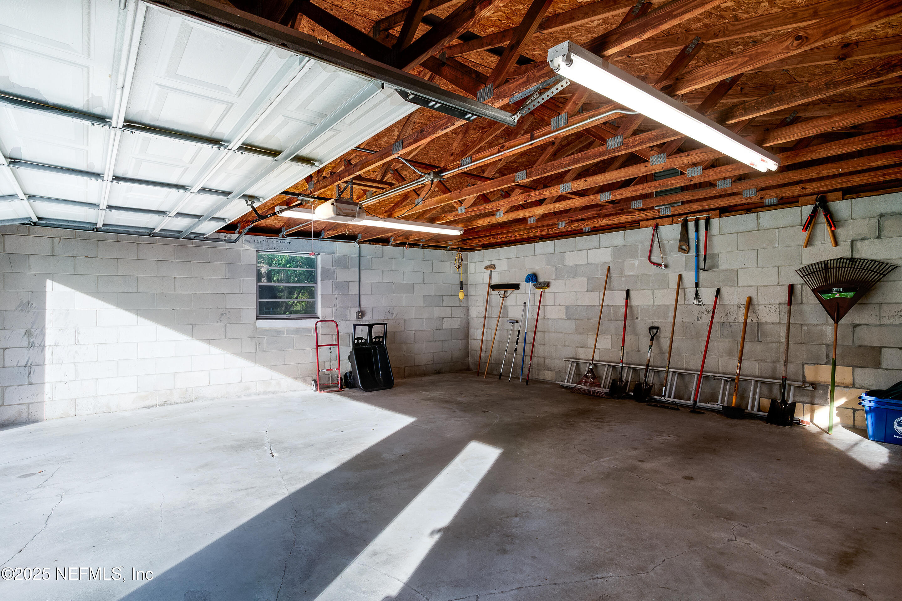 231 Knight Boxx Road Middleburg, FL 32068 - Photo 10 of 31 Garage door open