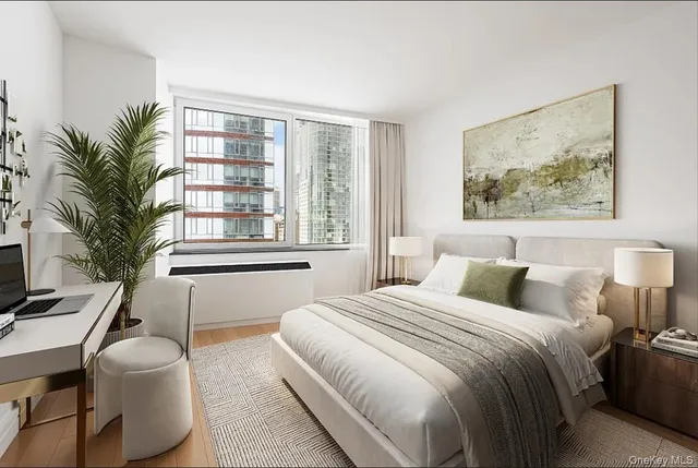 a bedroom with a large bed and a large window