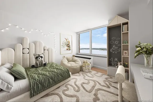 a bedroom with furniture and a large window