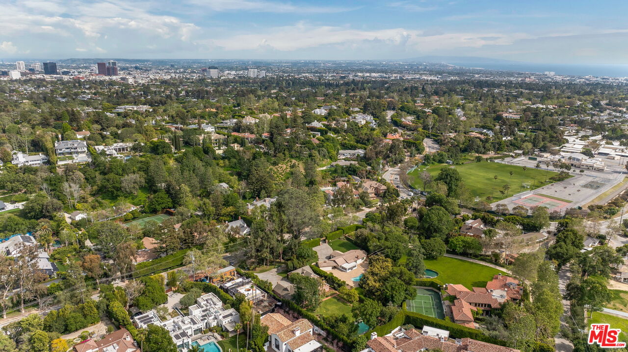1639 Mandeville Canyon Road Los Angeles, CA 90049 - Photo 9 of 10 an aerial view of a city with lots of residential buildings