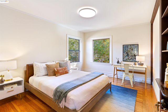a large bedroom with a bed and a book shelf
