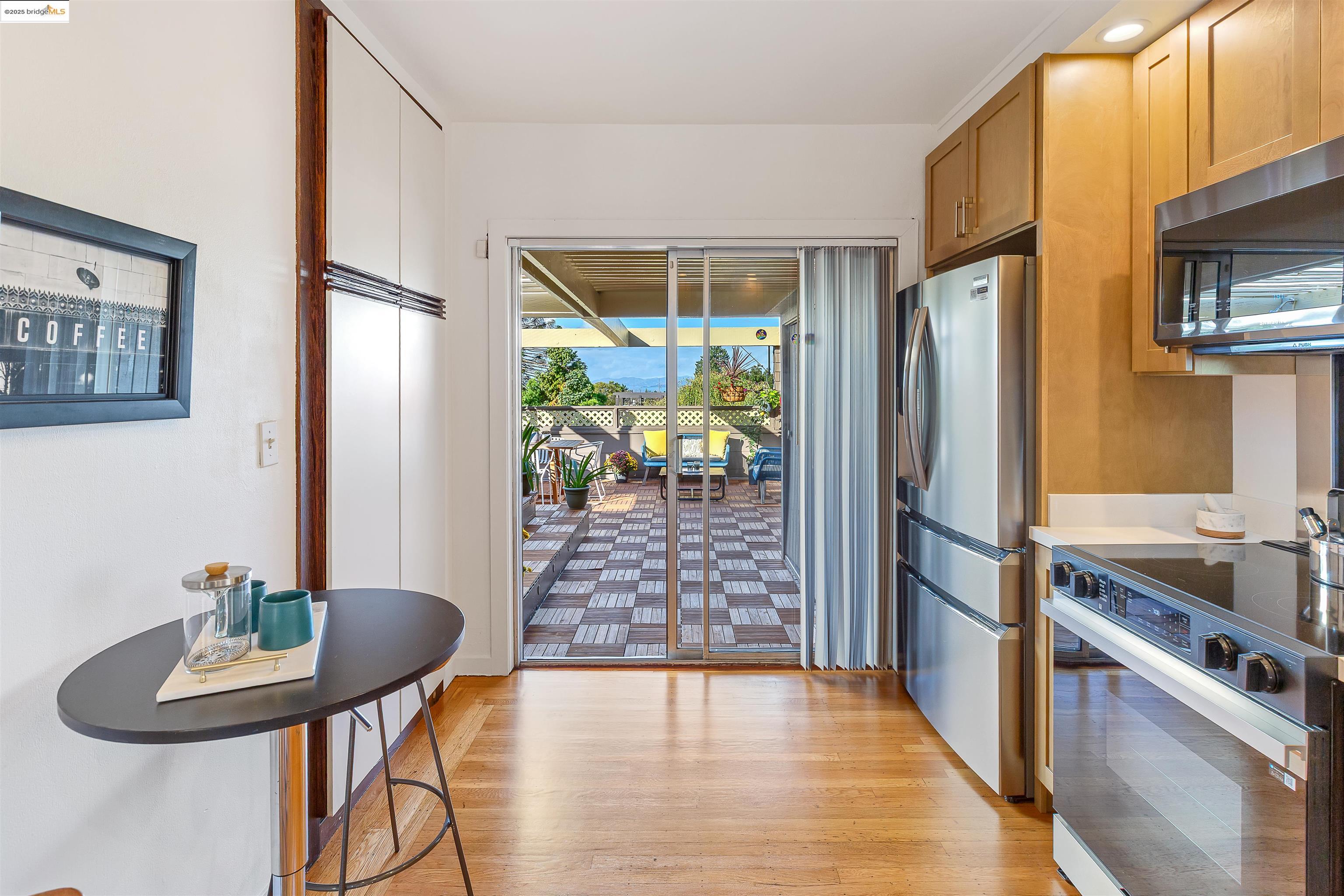 1512 Walnut Street Berkeley, CA 94709 - Photo 20 of 39 a kitchen with stainless steel appliances granite countertop a refrigerator a stove top oven a dining table and chairs