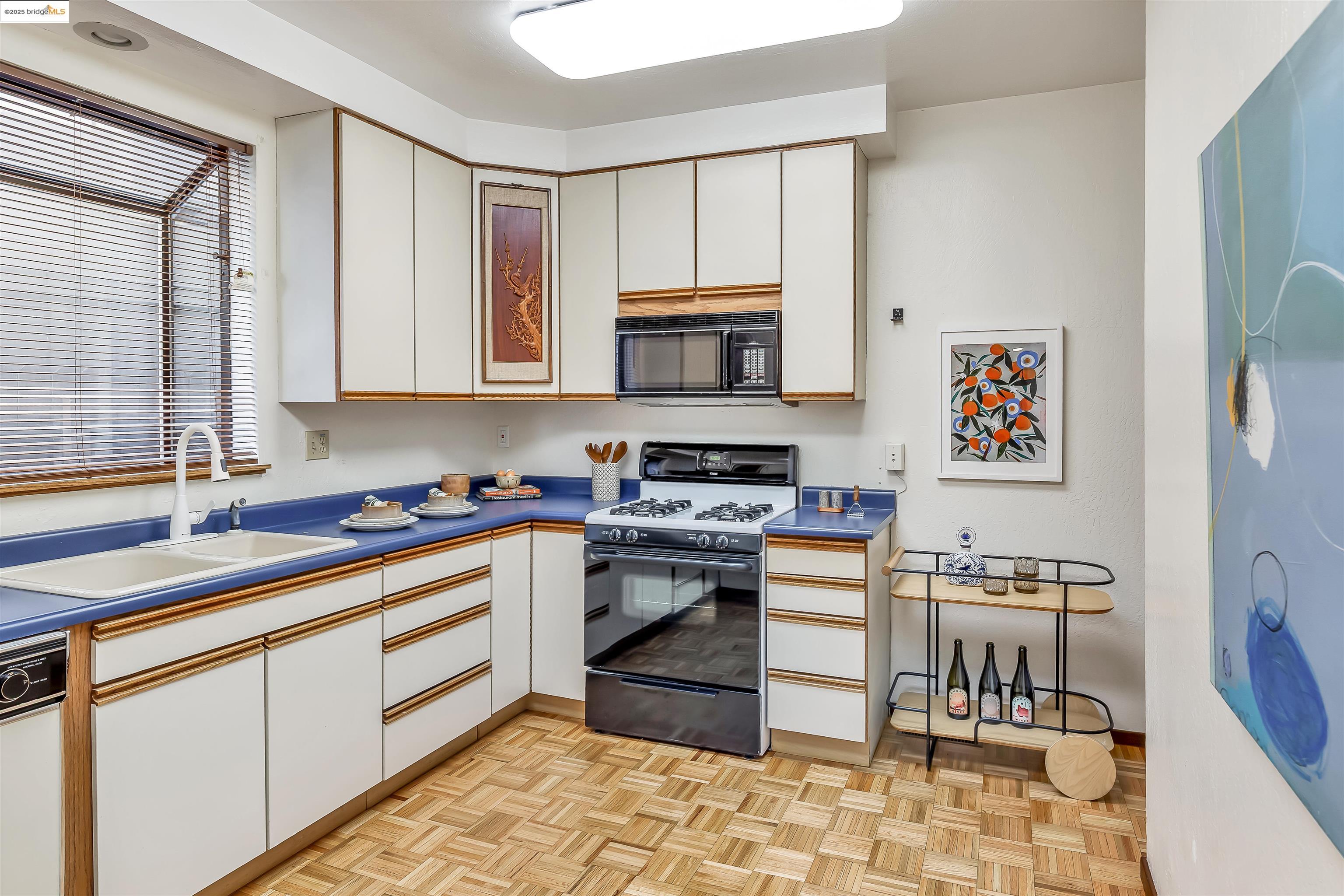 1512 Walnut Street Berkeley, CA 94709 - Photo 25 of 39 a kitchen with stainless steel appliances granite countertop a stove and a sink