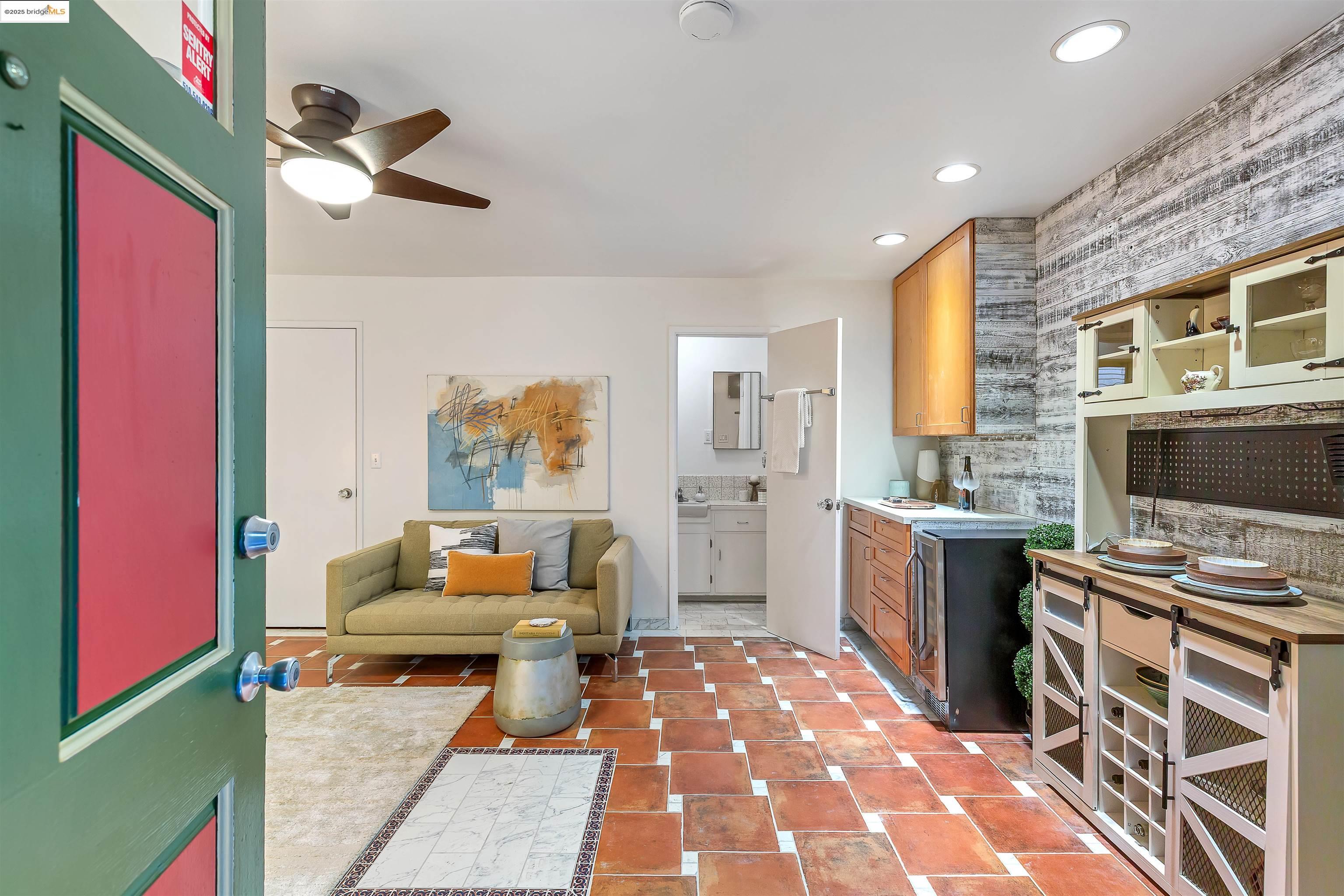 1512 Walnut Street Berkeley, CA 94709 - Photo 39 of 39 a living room with furniture a flat screen tv and kitchen view
