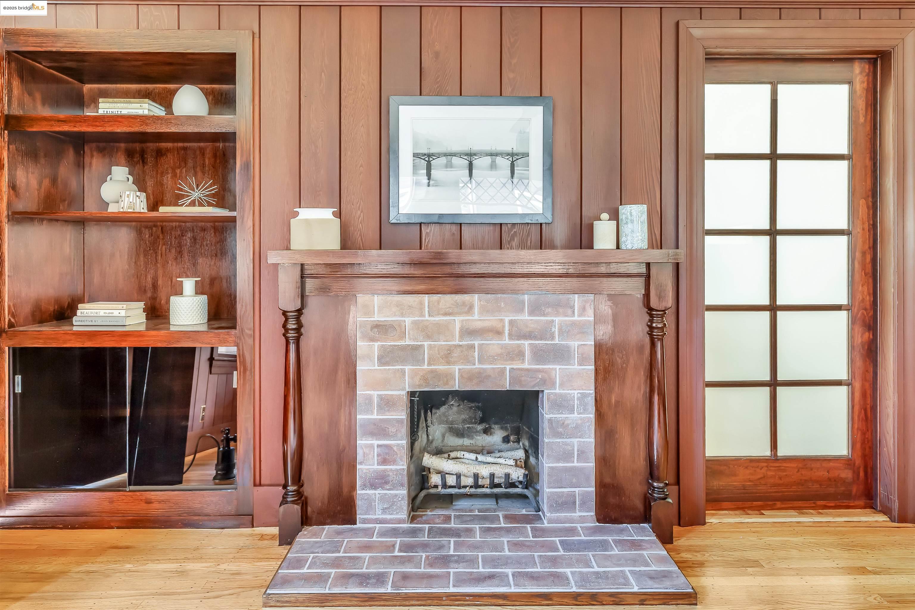1512 Walnut Street Berkeley, CA 94709 - Photo 7 of 39 a living room with a fireplace and a window
