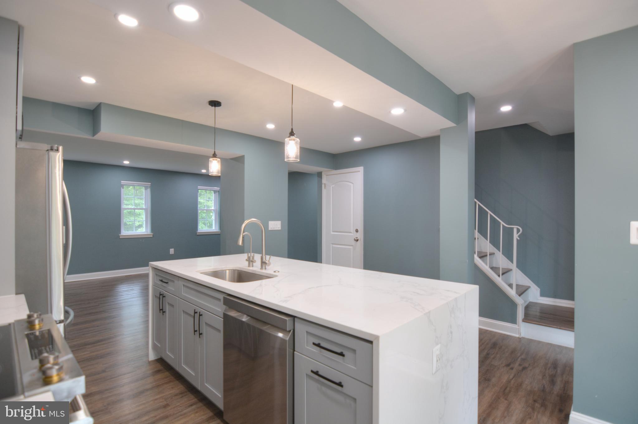 3822 Gawayne Terrace, Unit 32382 Silver Spring, MD 20906 - Photo 15 of 32 a bathroom with a sink a toilet and a mirror