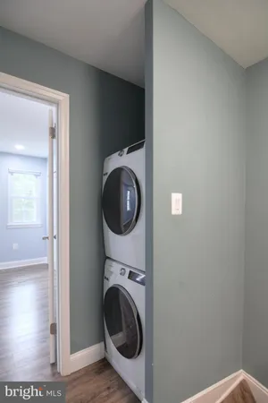 a view of a hallway with washer and dryer