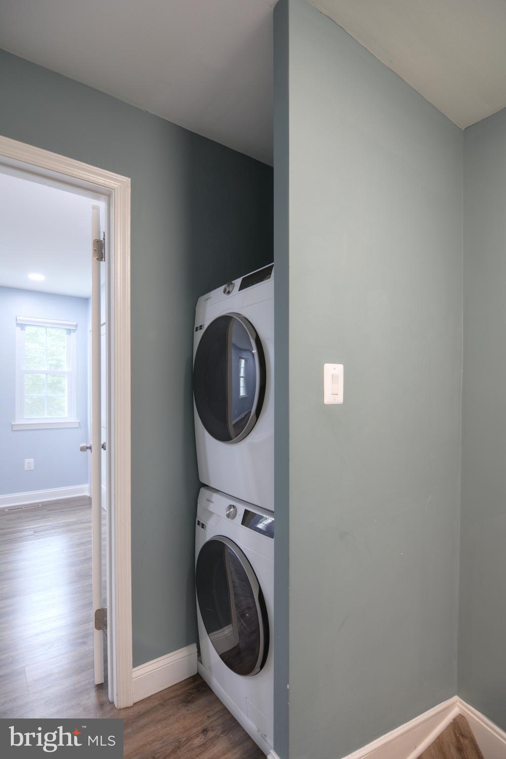 3822 Gawayne Terrace, Unit 32382 Silver Spring, MD 20906 - Photo 28 of 32 a view of a hallway with washer and dryer