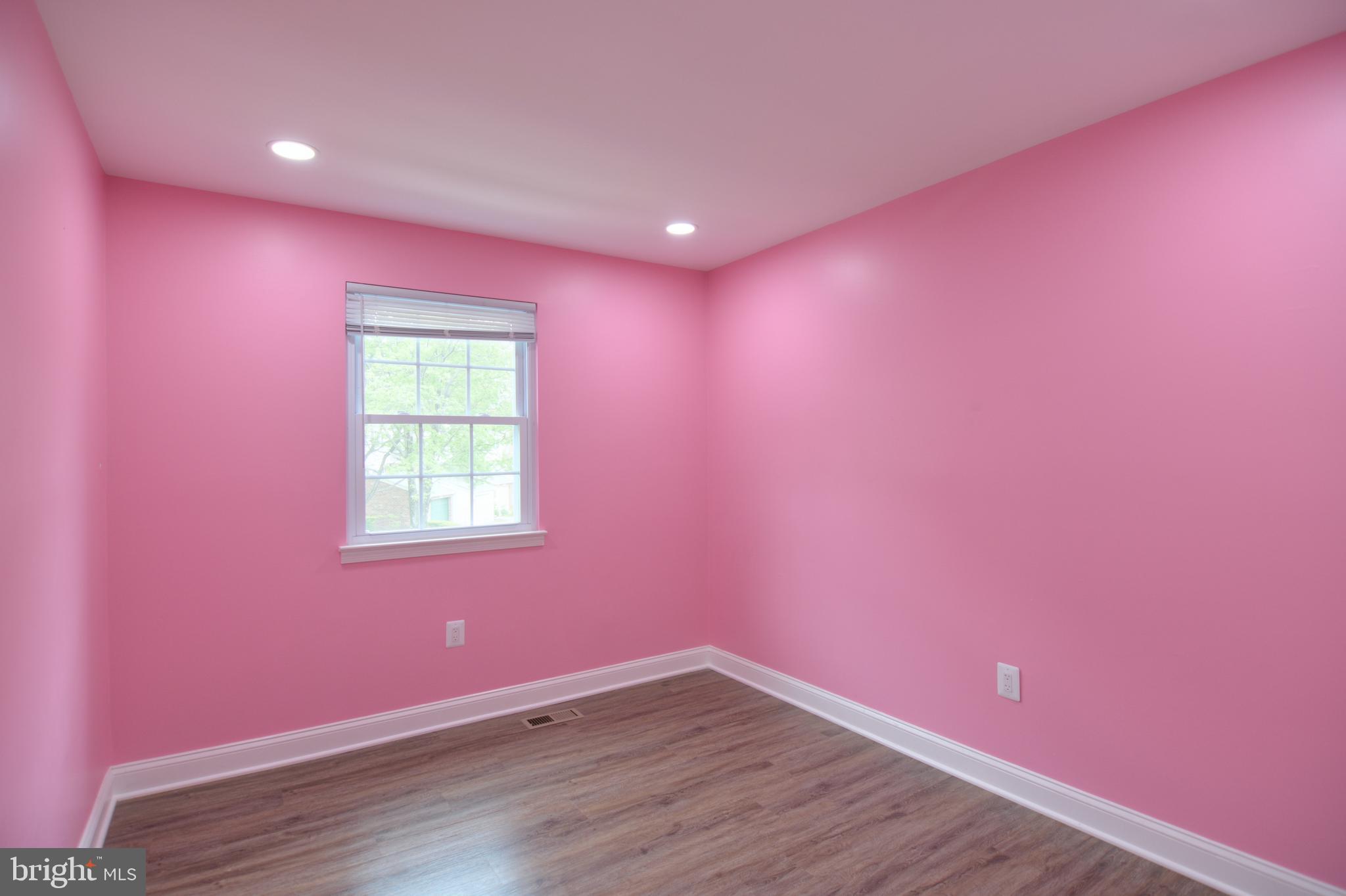 3822 Gawayne Terrace, Unit 32382 Silver Spring, MD 20906 - Photo 30 of 32 a view of empty room with wooden floor and fan