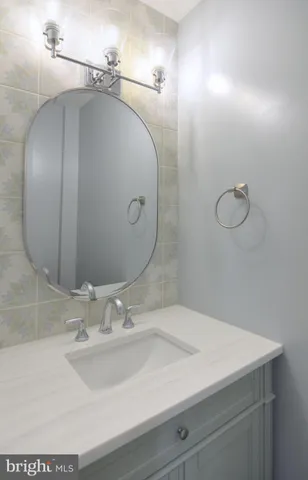 a bathroom with a sink and mirror