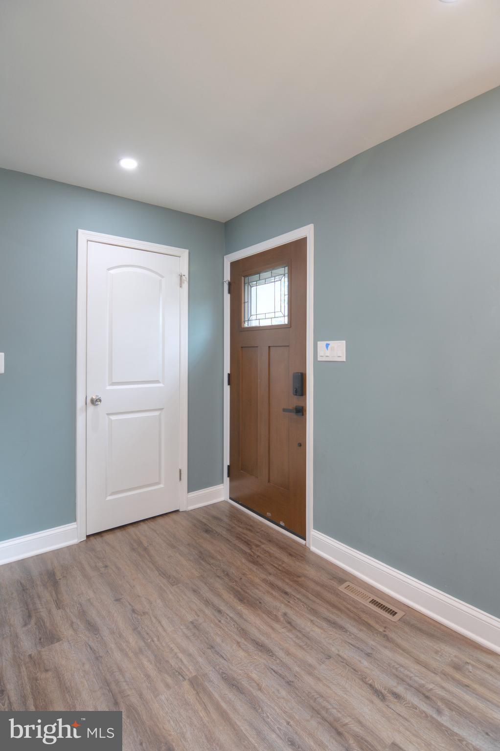 3822 Gawayne Terrace, Unit 32382 Silver Spring, MD 20906 - Photo 5 of 32 a view of an empty room with wooden floor