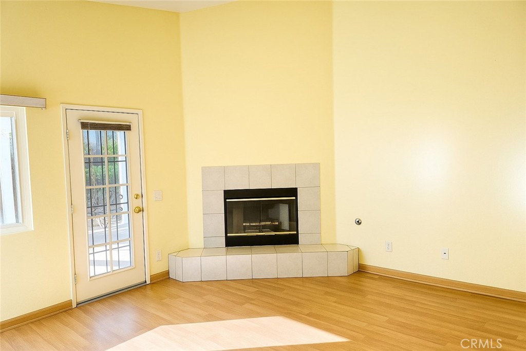 1457 Angelus Hill Road Hemet, CA 92545 - Photo 12 of 13 a view of a livingroom with a fireplace and a window