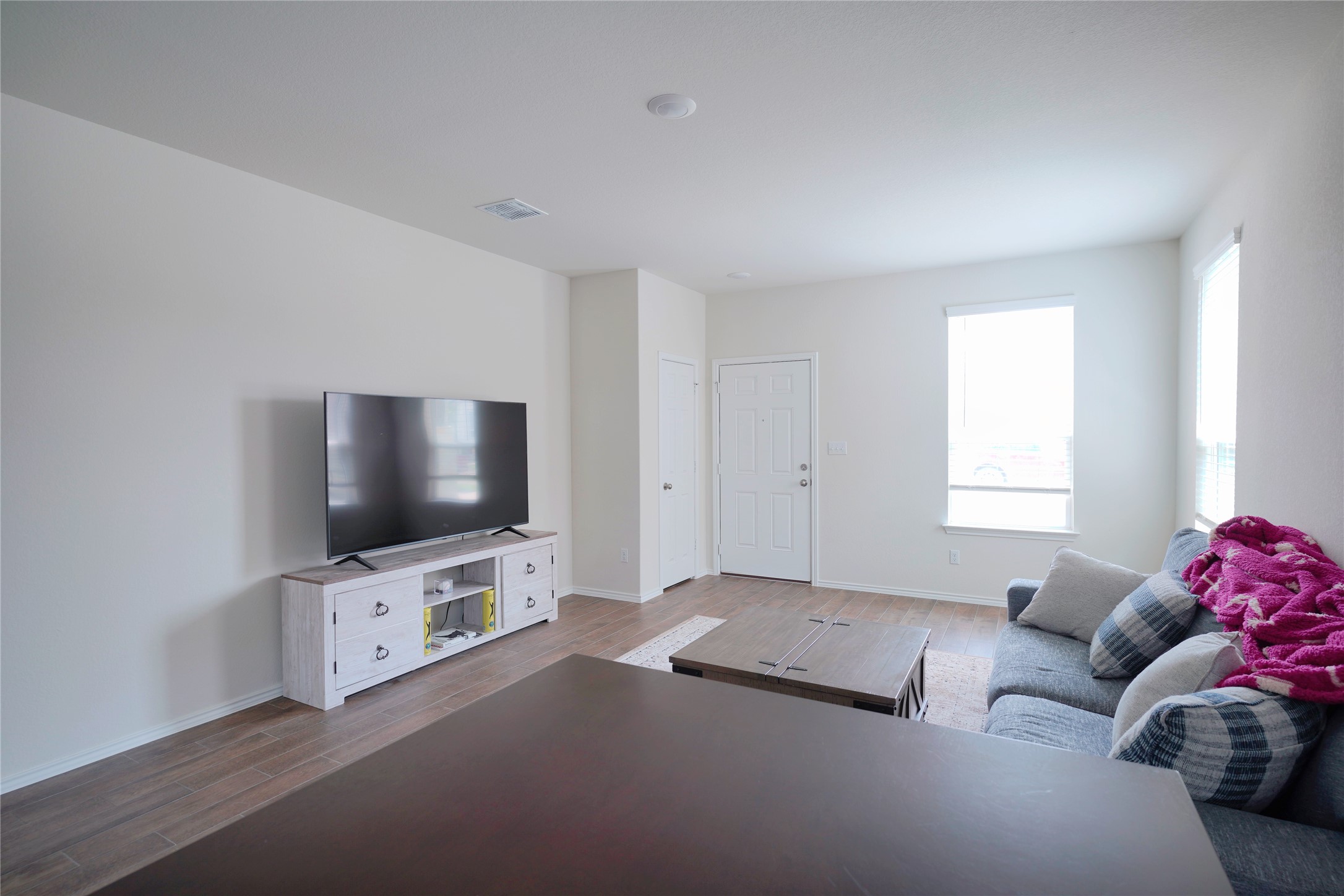 545 Tree Nut Loop Buda, TX 78610 - Photo 2 of 19 Clean lines and smooth flooring define this versatile, open living space.