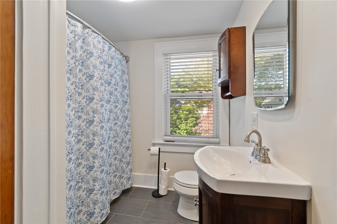 235 Wildmere Road Irondequoit, NY 14617 - Photo 26 of 41 The UPDATED FULL BATH on the second floor- there’s a door here that leads to the partially finished attic space/office