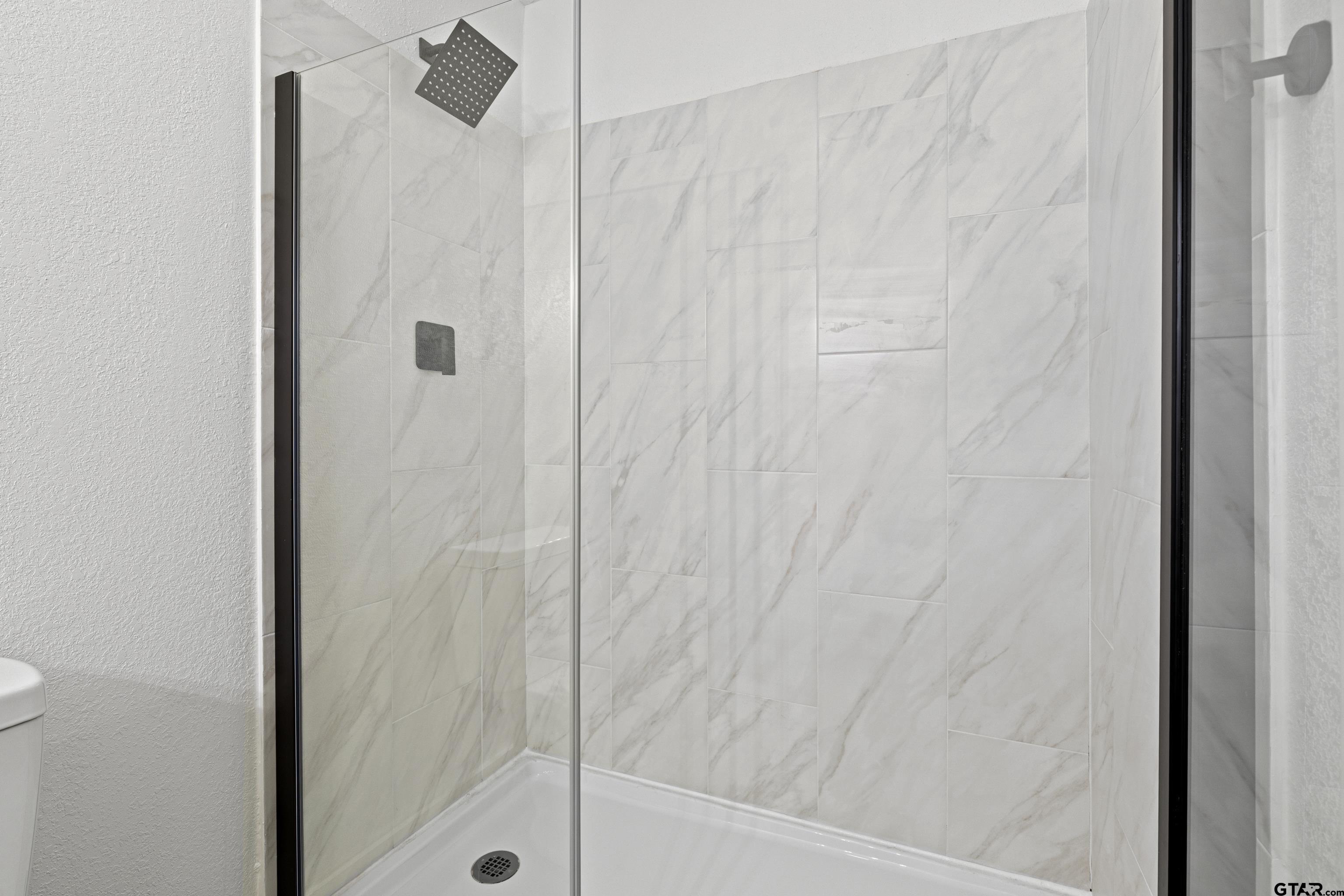 1907 Beth Drive Longview, TX 75605 - Photo 36 of 39 a bathroom with a shower