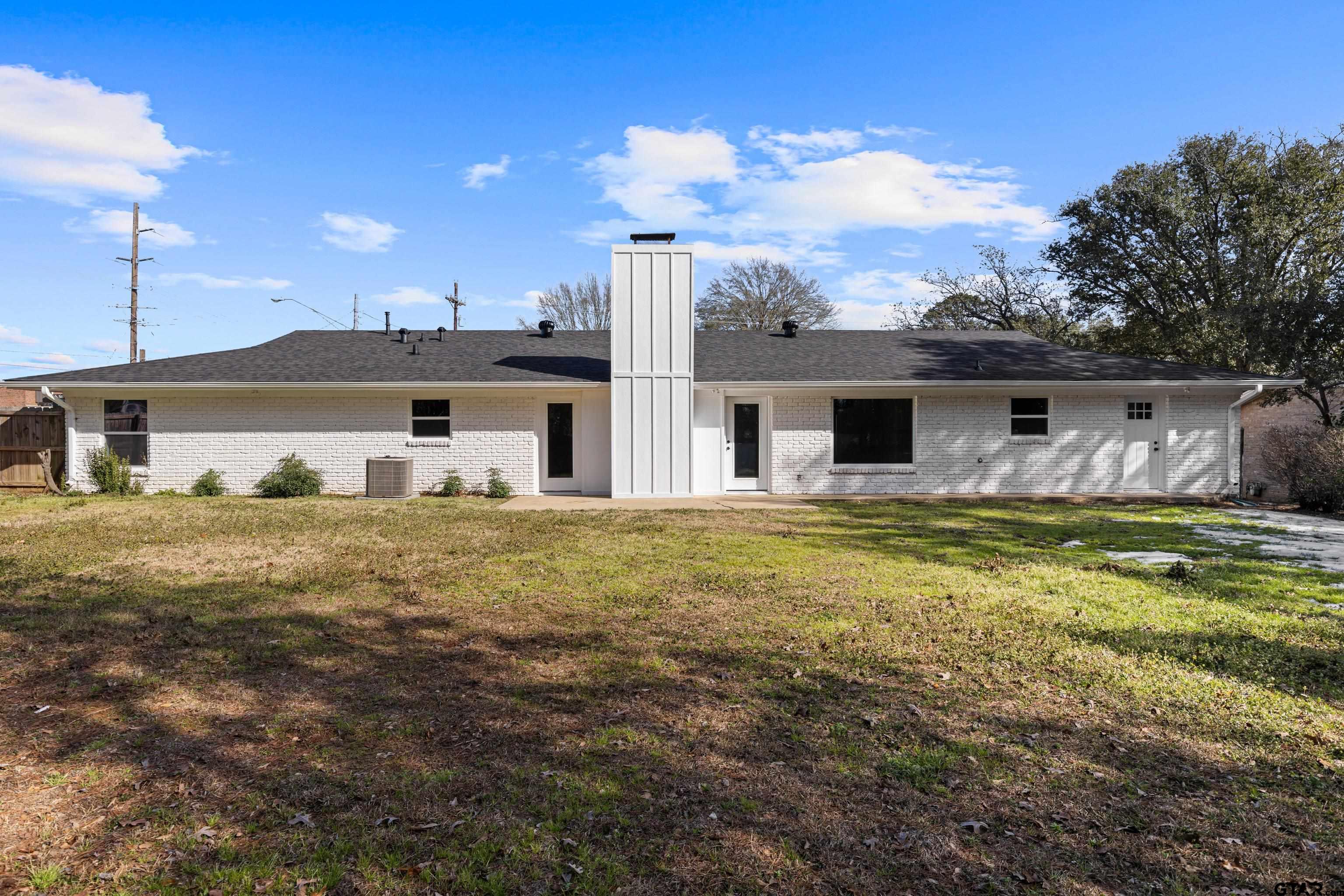 1907 Beth Drive Longview, TX 75605 - Photo 39 of 39 a view of a house with a big yard and a large tree