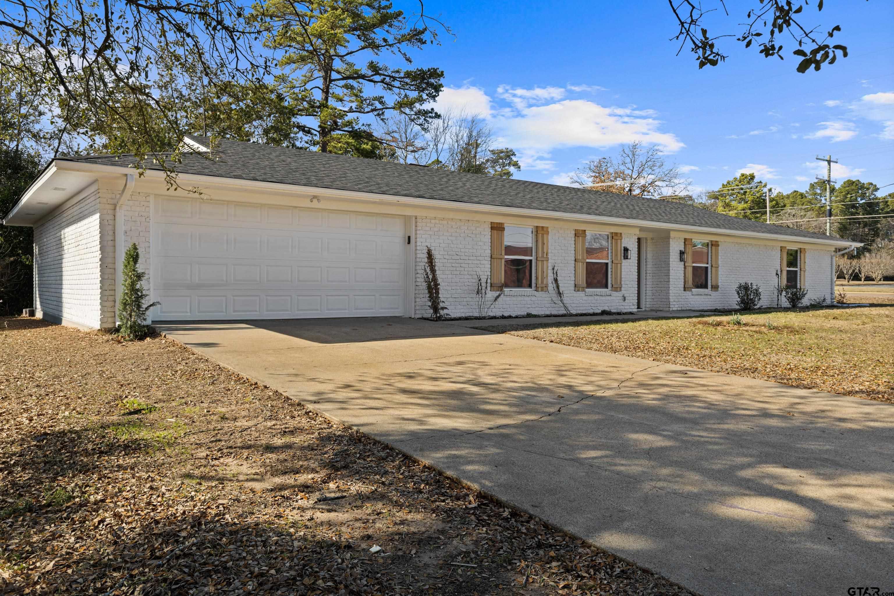 1907 Beth Drive Longview, TX 75605 - Photo 7 of 39 a view of a house with a yard