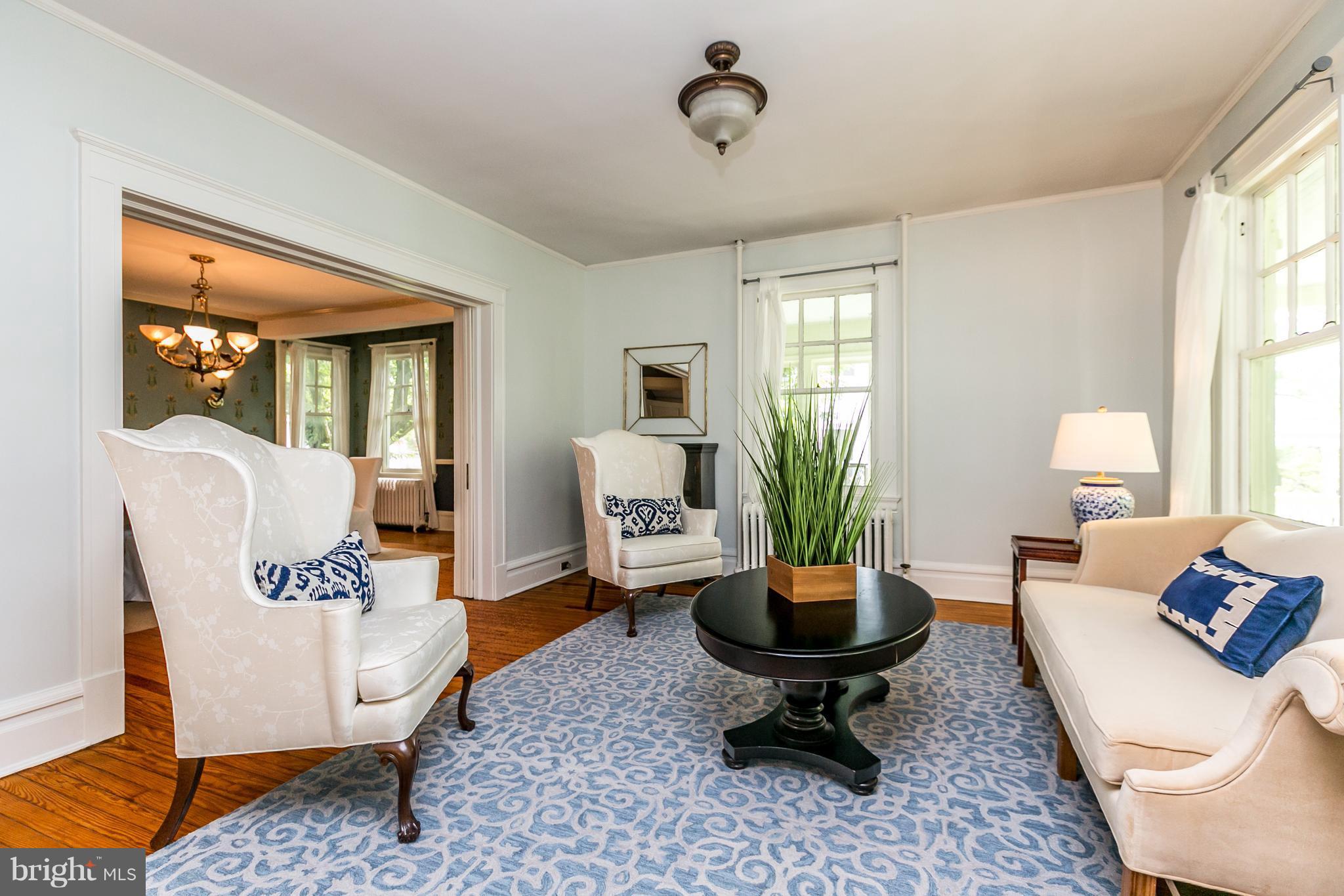 205 Hawthorn Road Baltimore, MD 21210 - Photo 5 of 29 Living Room with Pocket Doors into Dining Room