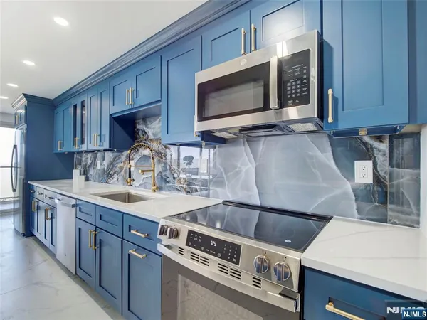 a kitchen with a stove and a microwave