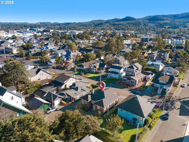 an aerial view of residential houses with outdoor space