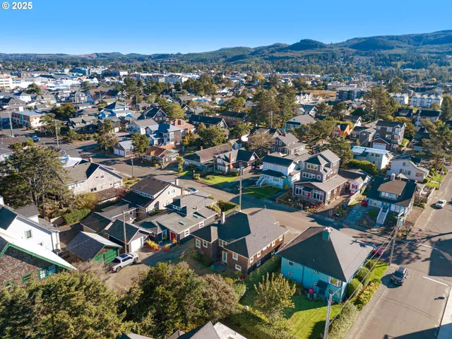an aerial view of residential houses with outdoor space