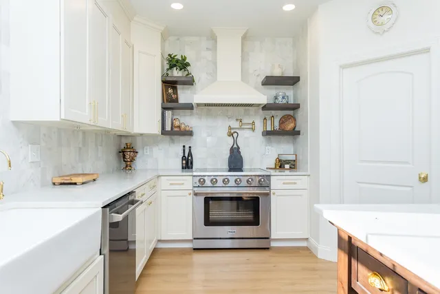 a view of a house with swimming pool and sitting area