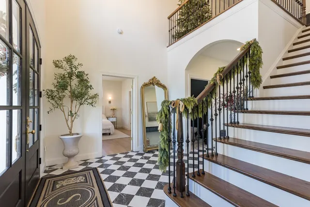 a kitchen with a refrigerator and a sink
