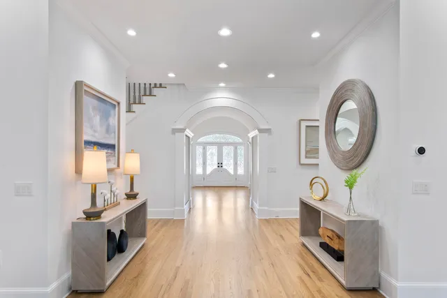a view of a living room a dining room wooden floor and a fireplace