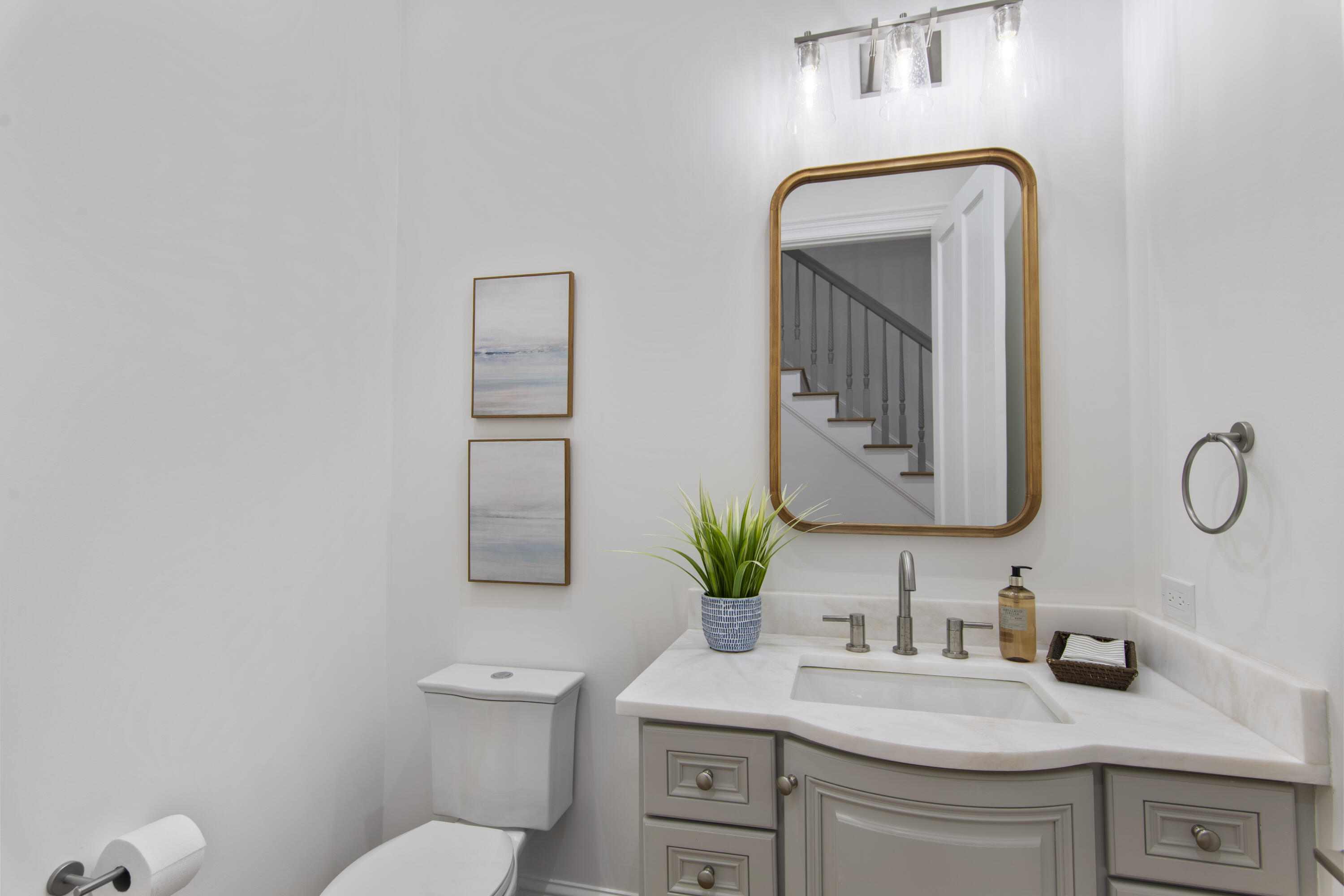 671 Driftwood Point Road Santa Rosa Beach, FL 32459 - Photo 19 of 41 a bathroom with a toilet sink and mirror
