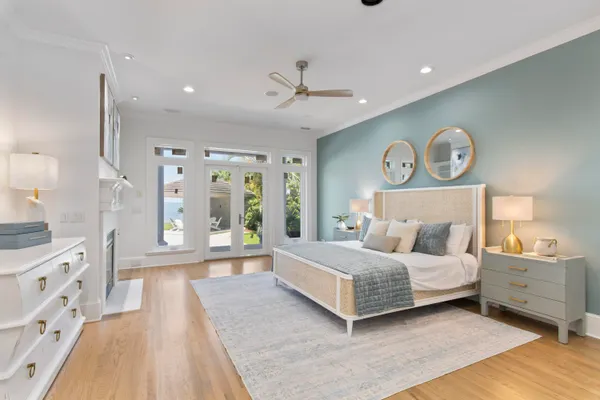 a bedroom with a large bed and a large window