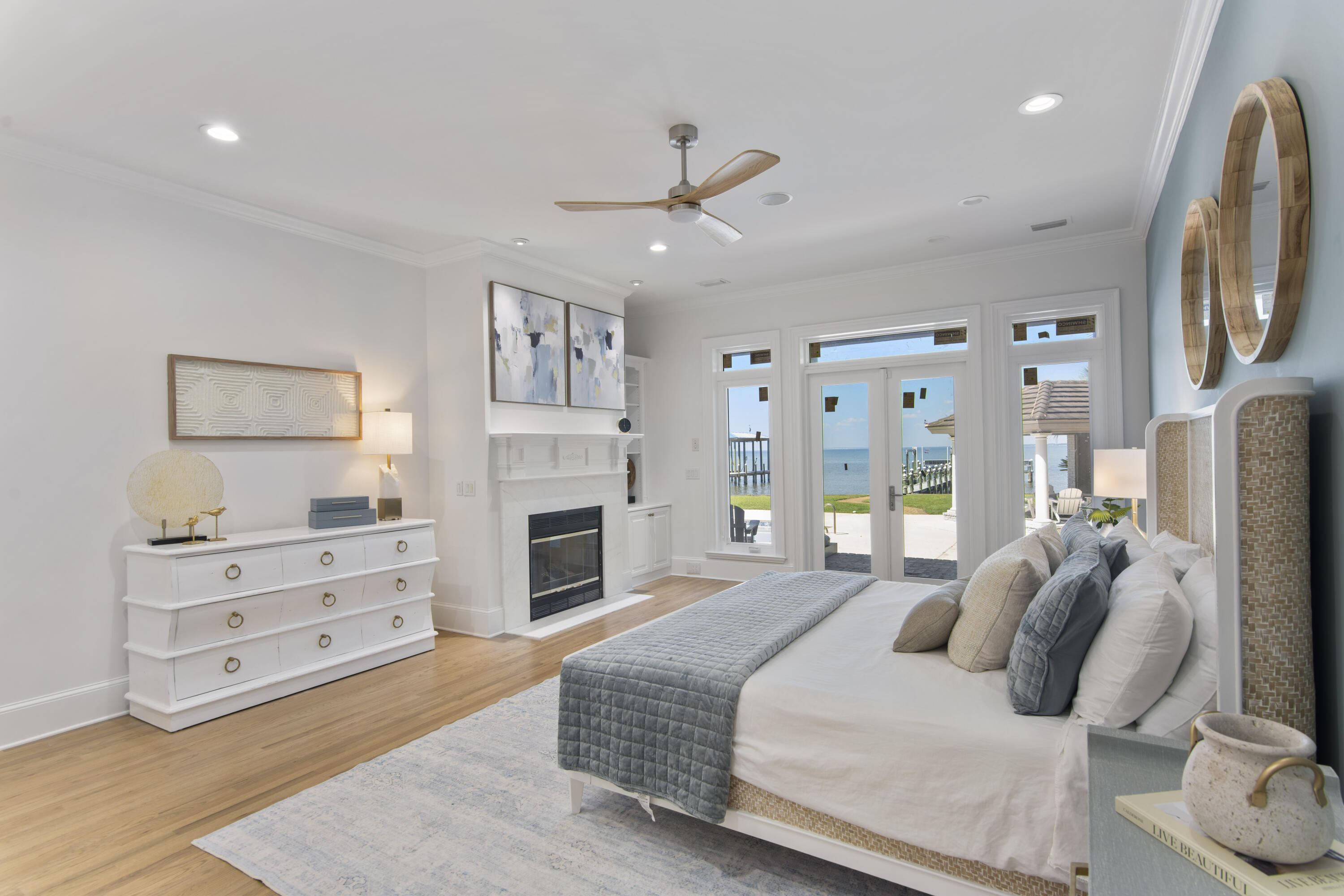 671 Driftwood Point Road Santa Rosa Beach, FL 32459 - Photo 21 of 41 a bedroom with furniture and a fireplace