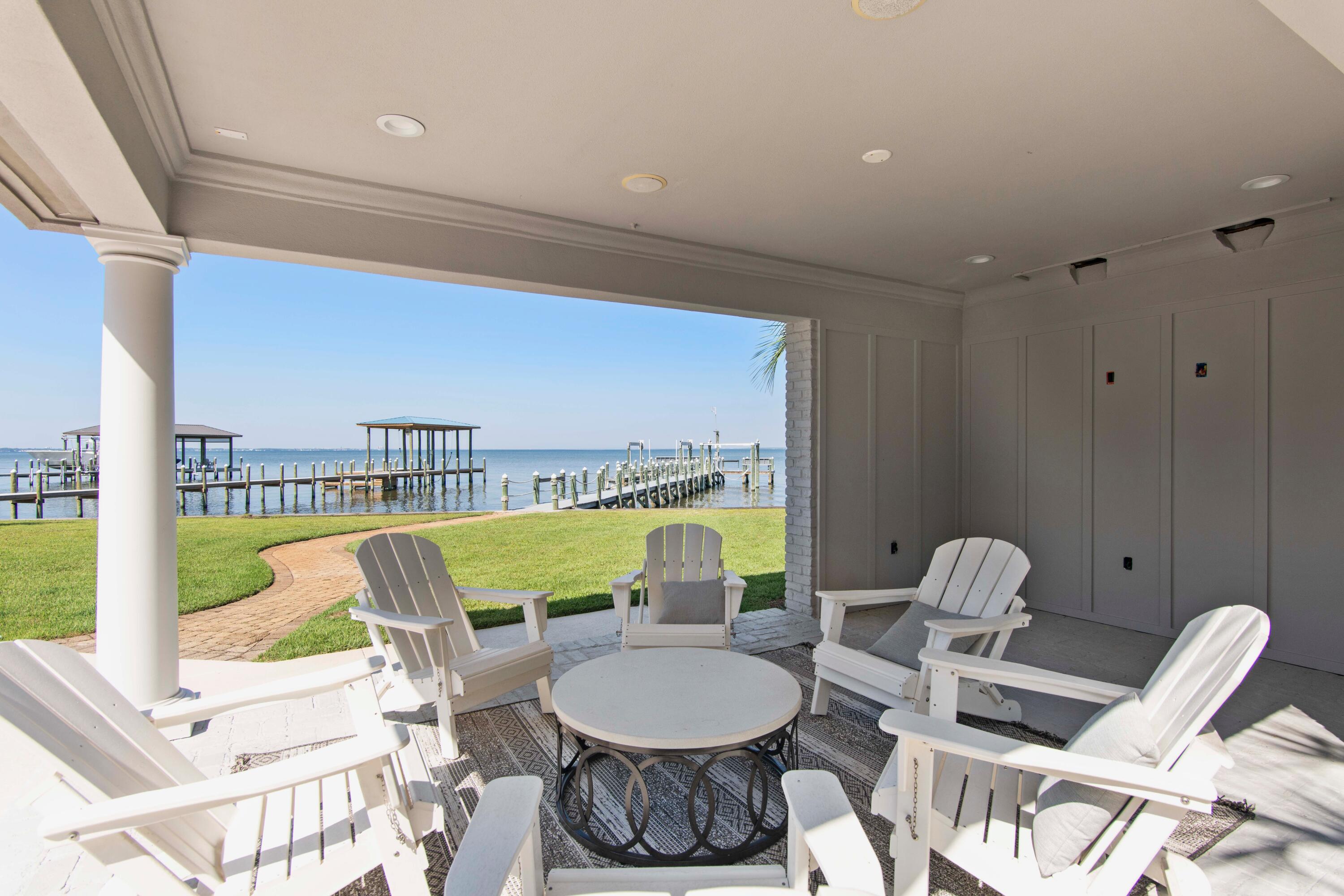 671 Driftwood Point Road Santa Rosa Beach, FL 32459 - Photo 3 of 41 a living room with furniture and a large window