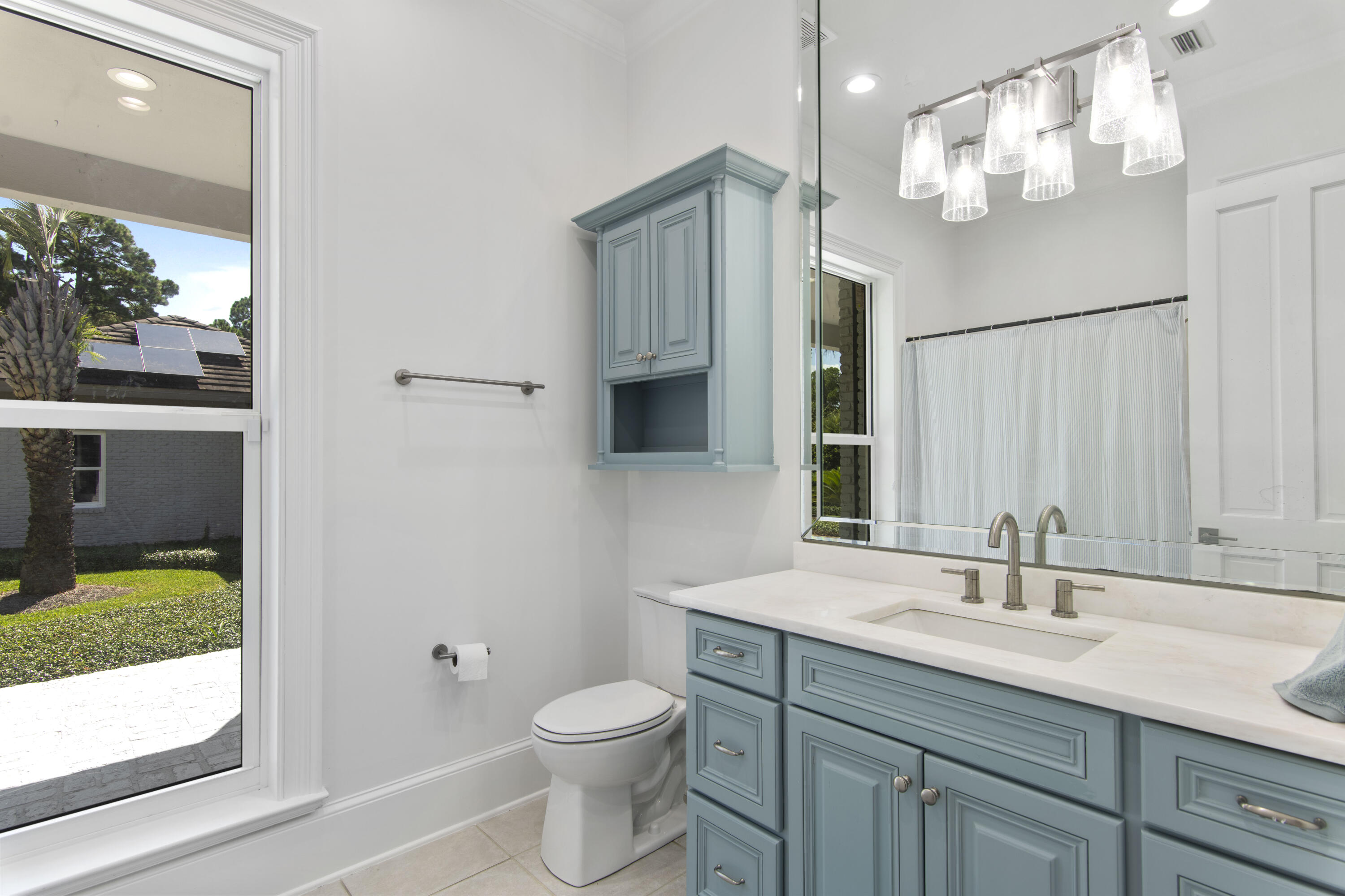 671 Driftwood Point Road Santa Rosa Beach, FL 32459 - Photo 31 of 41 a bathroom with a granite countertop sink a toilet and a mirror