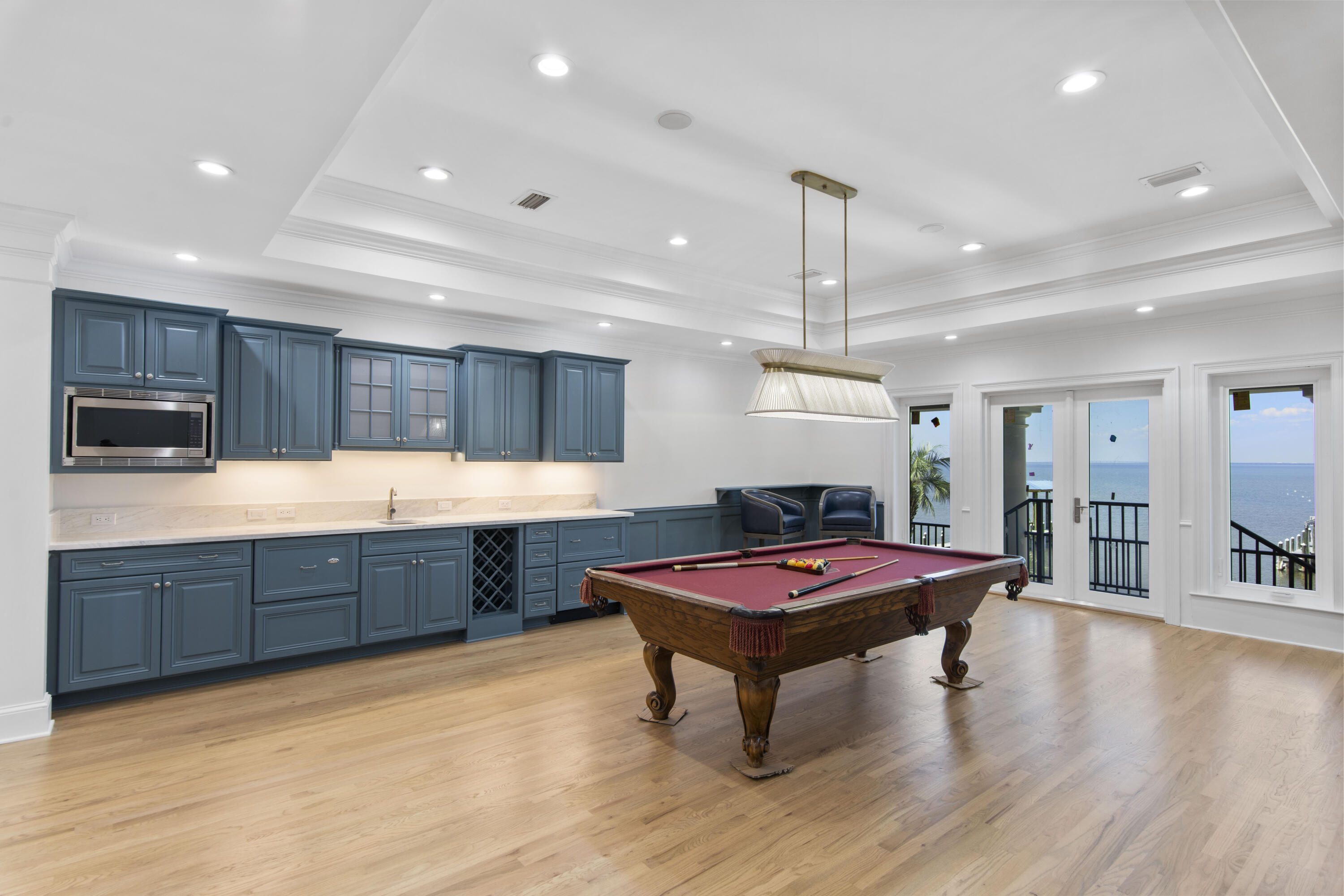671 Driftwood Point Road Santa Rosa Beach, FL 32459 - Photo 33 of 41 a kitchen with stainless steel appliances granite countertop a refrigerator a sink dishwasher a dining table and chairs with wooden floor