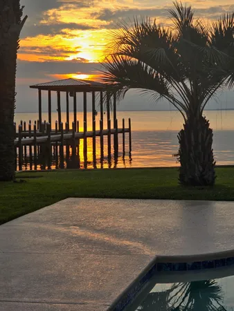 a view of swimming pool with a yard