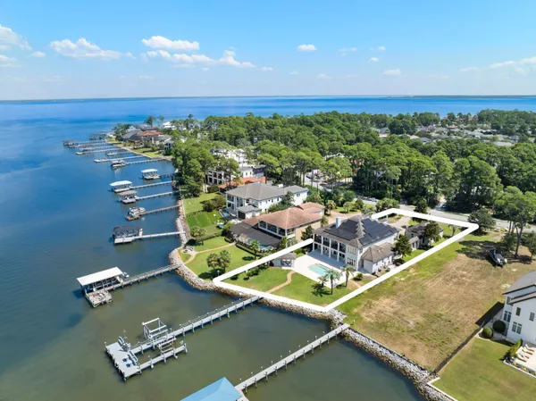 an aerial view of a house with a swimming pool