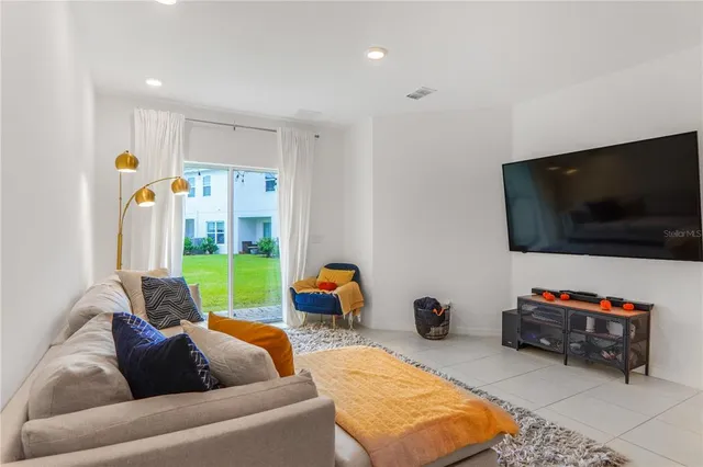 an aerial view of a house with garden space and street view