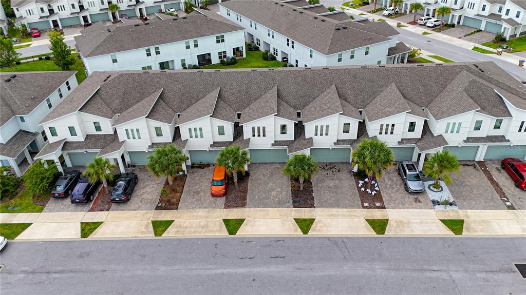 3510 Beau Road Kissimmee, FL 34746 - Photo 39 of 50 an aerial view of multiple houses with a yard