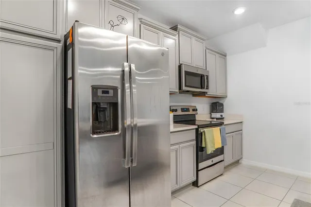 an aerial view of a house with a garden and swimming pool