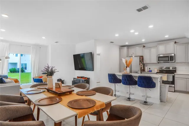 an aerial view of a house with garden space and street view