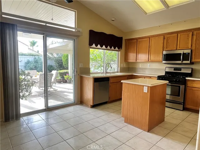 a view of a sink a window with a kitchen