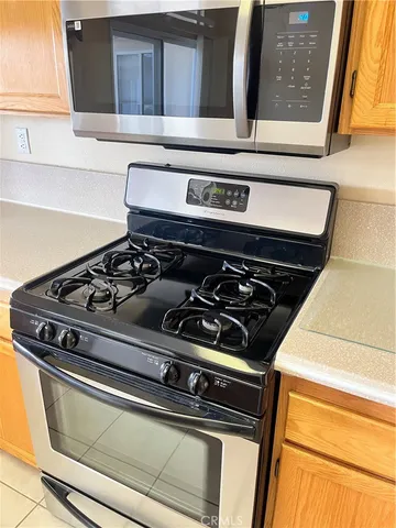 a kitchen with a sink a stove and refrigerator