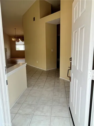a view of a kitchen from the hallway