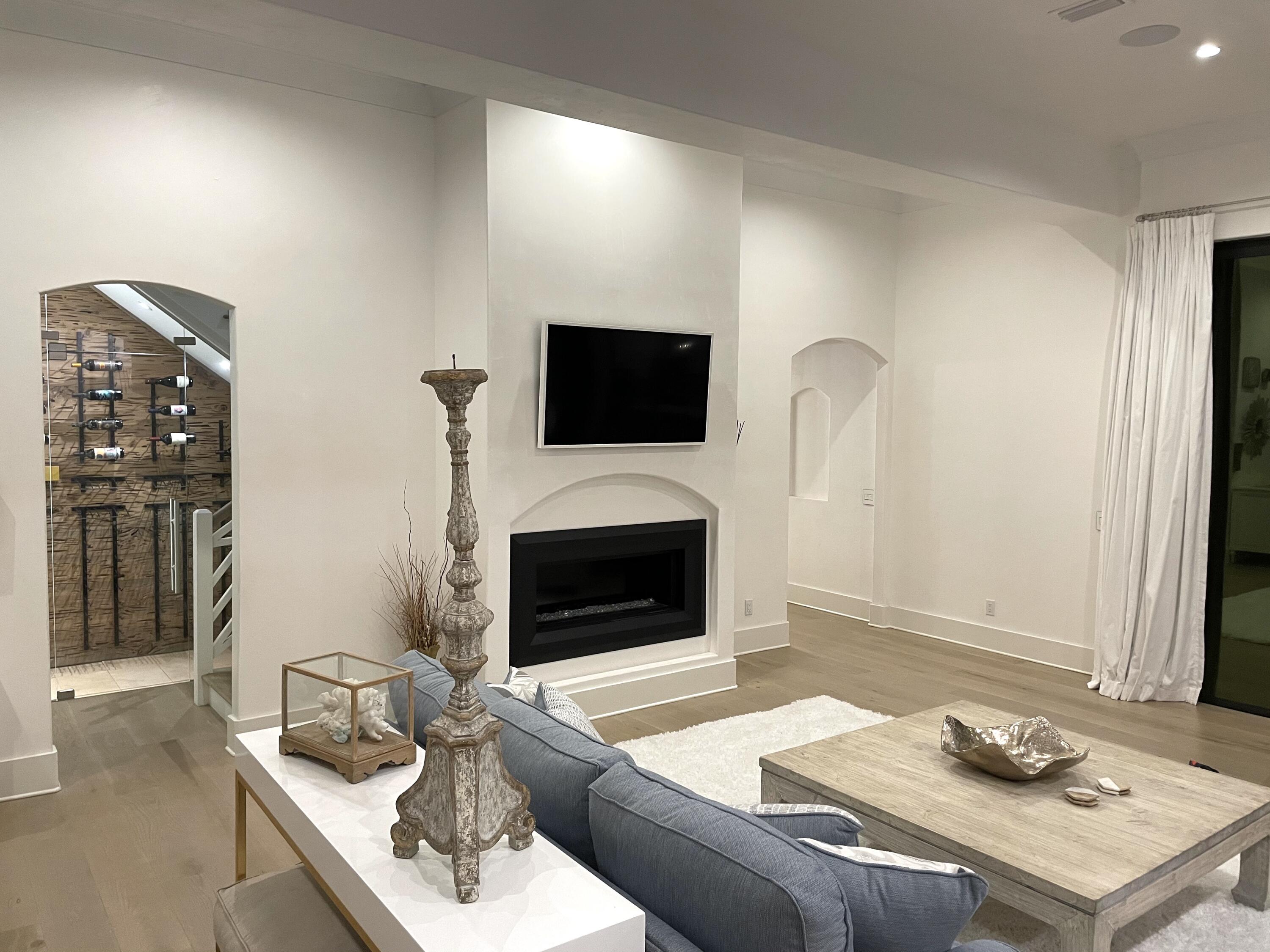 69 Brenda Lane Inlet Beach, FL 32461 - Photo 15 of 46 a living room with furniture a flat screen tv and a fireplace