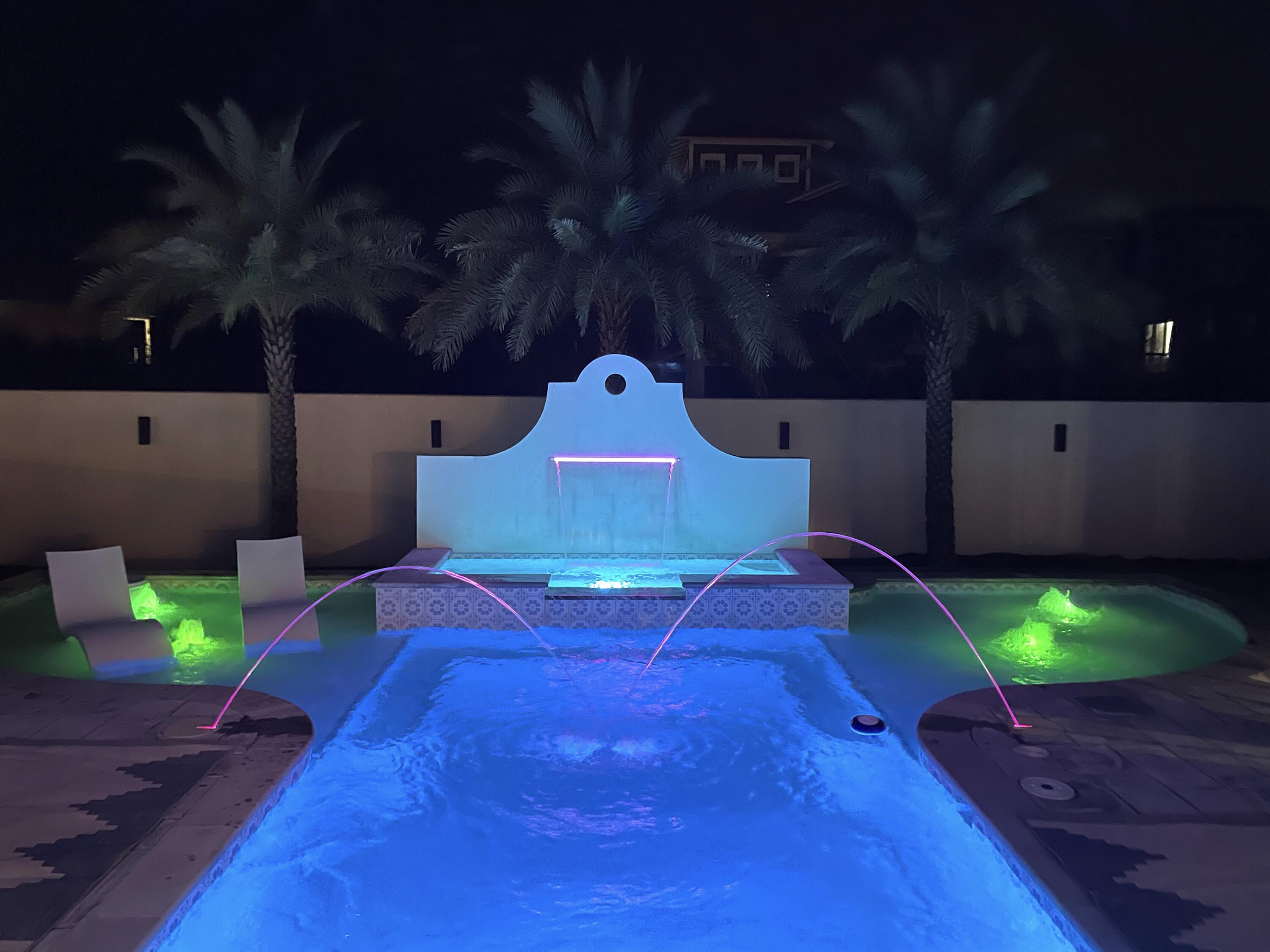 69 Brenda Lane Inlet Beach, FL 32461 - Photo 22 of 46 a swimming pool with some trees in the background