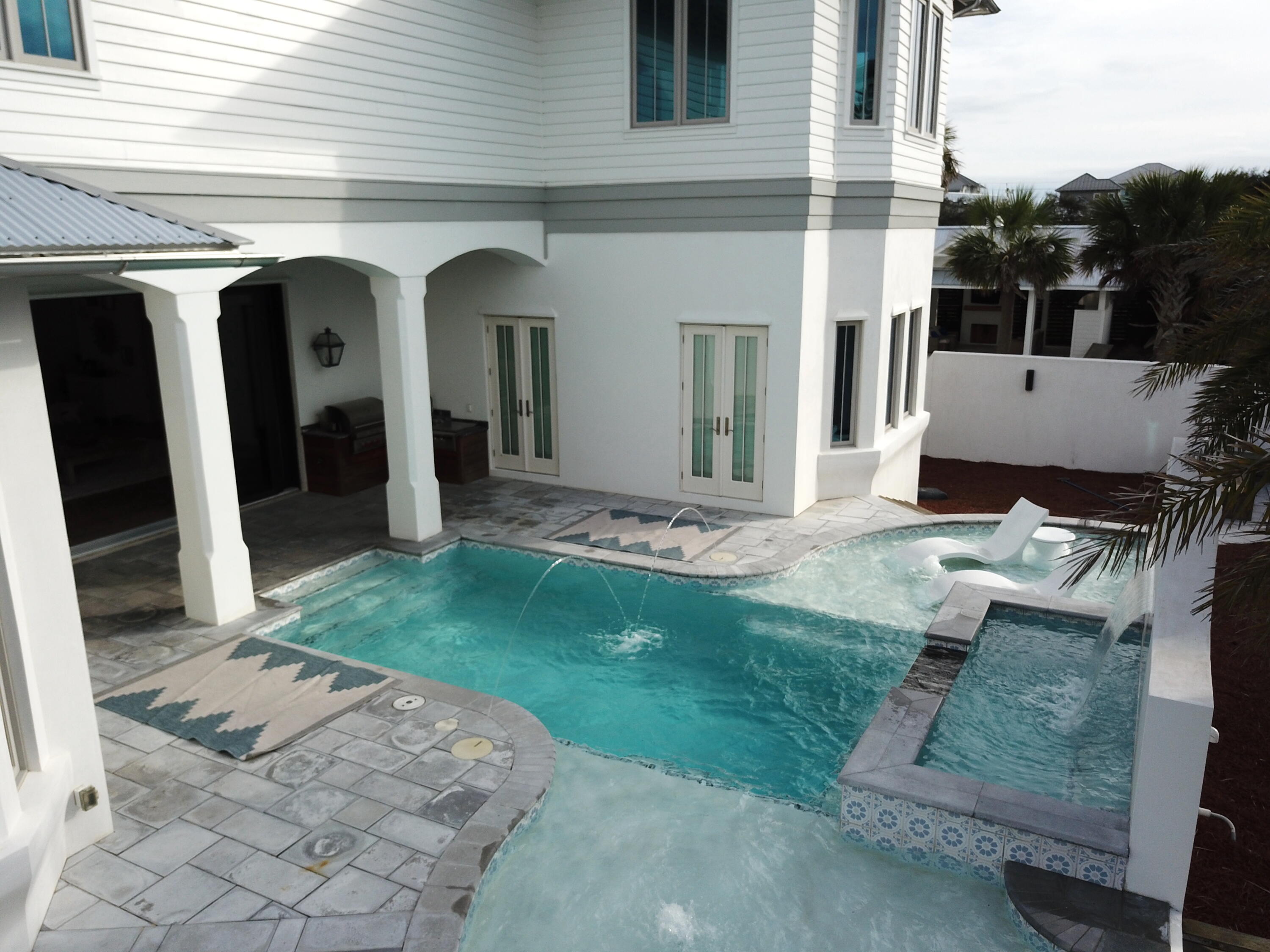69 Brenda Lane Inlet Beach, FL 32461 - Photo 24 of 46 a front view of a house with garden