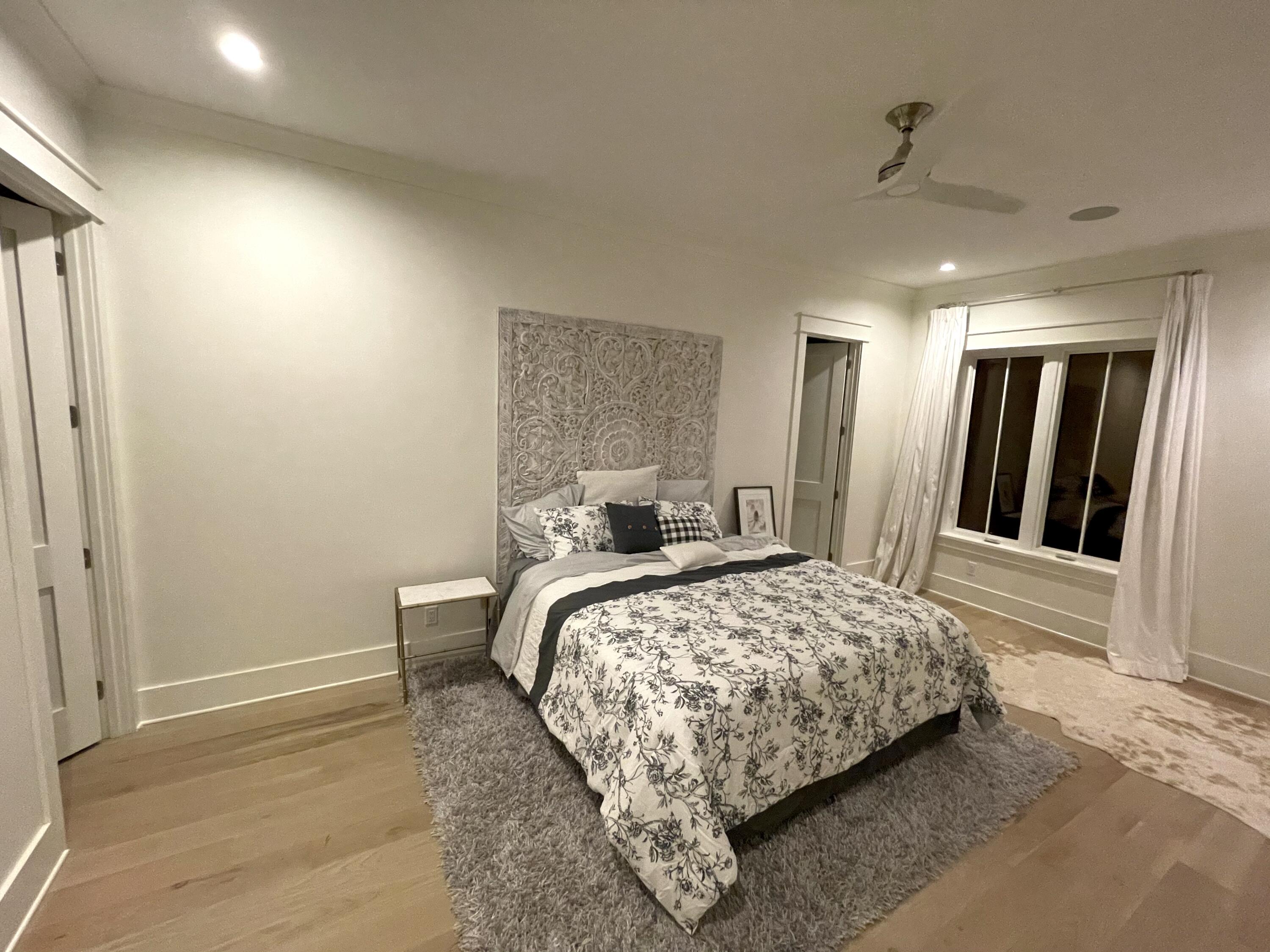 69 Brenda Lane Inlet Beach, FL 32461 - Photo 28 of 46 a bedroom with a bed and a large mirror